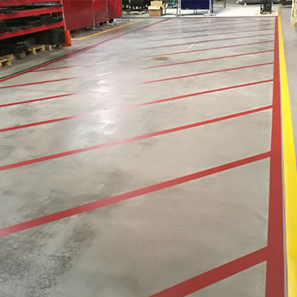 Drošības līniju līmēšana un krāsošana